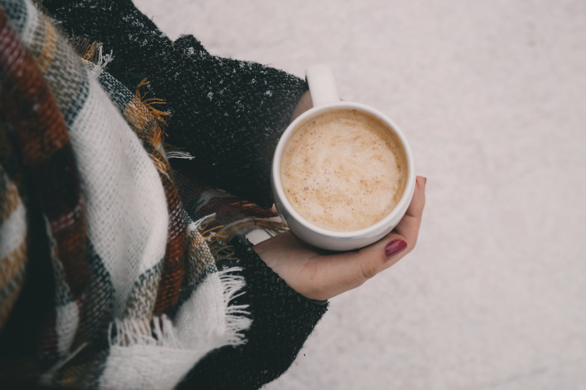 Women holding coffee - Winter care tips for new mothers.