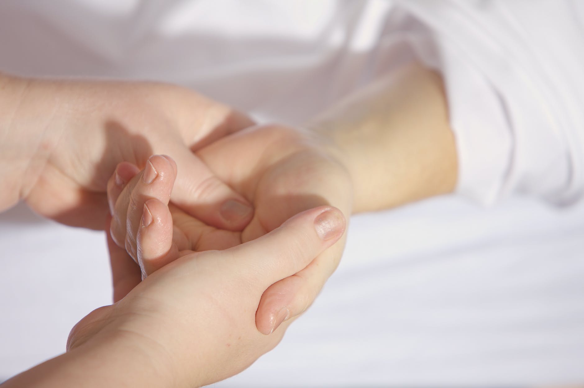 A mother holding baby's hand - winter care tips for new mothers