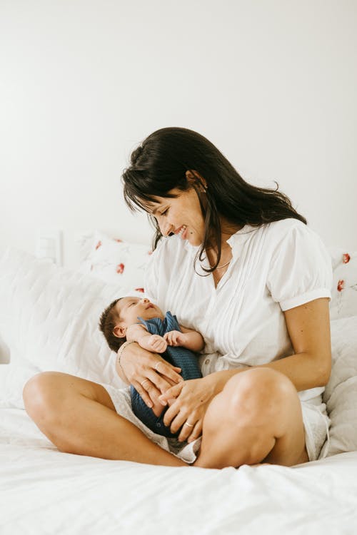 mom holding the baby in her laps