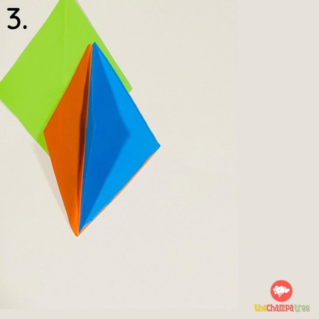 2 Colored papers - folded and placed over each other - DIY Kite