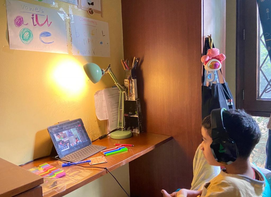 A boy attending virtual class