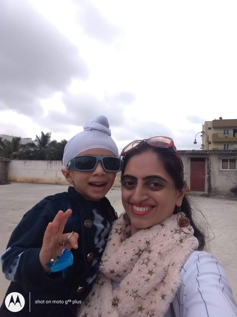 Real Mom Jaspreet Kohli holding her son