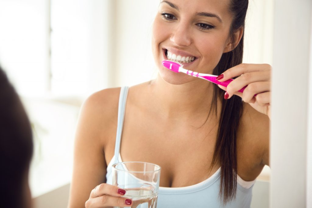 Woman brushing her teeth