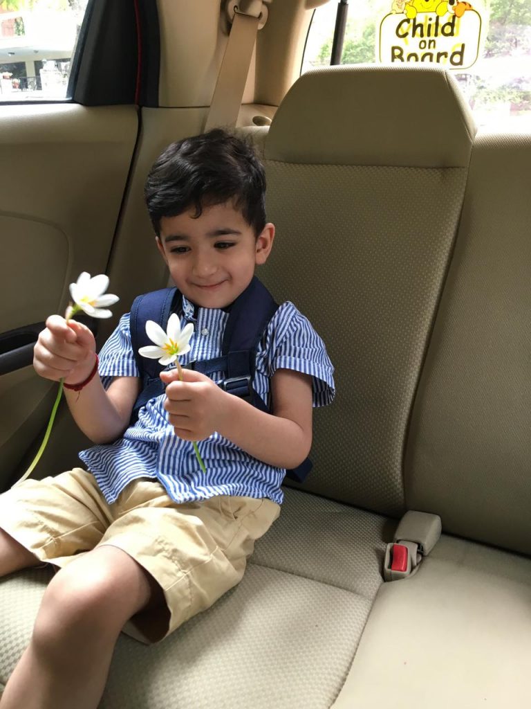 A boy holding a flower