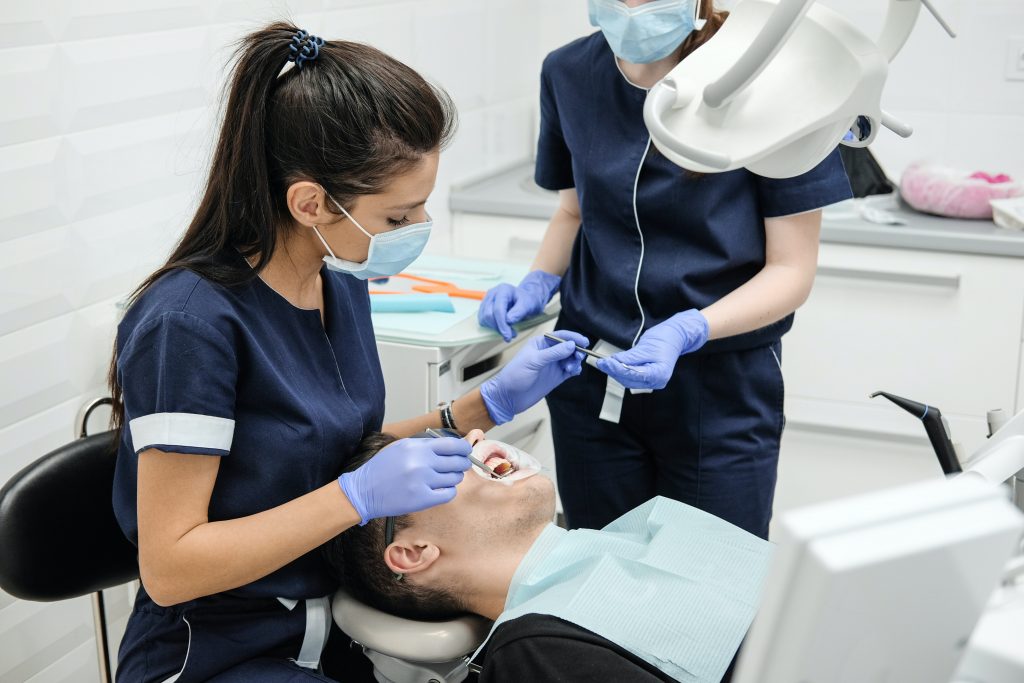 RCT Teeth - Dentist doing root canal