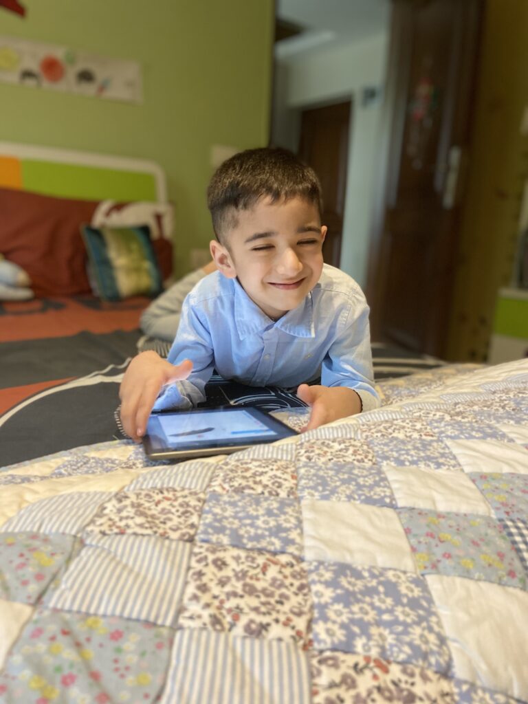 Happy boy on iPad