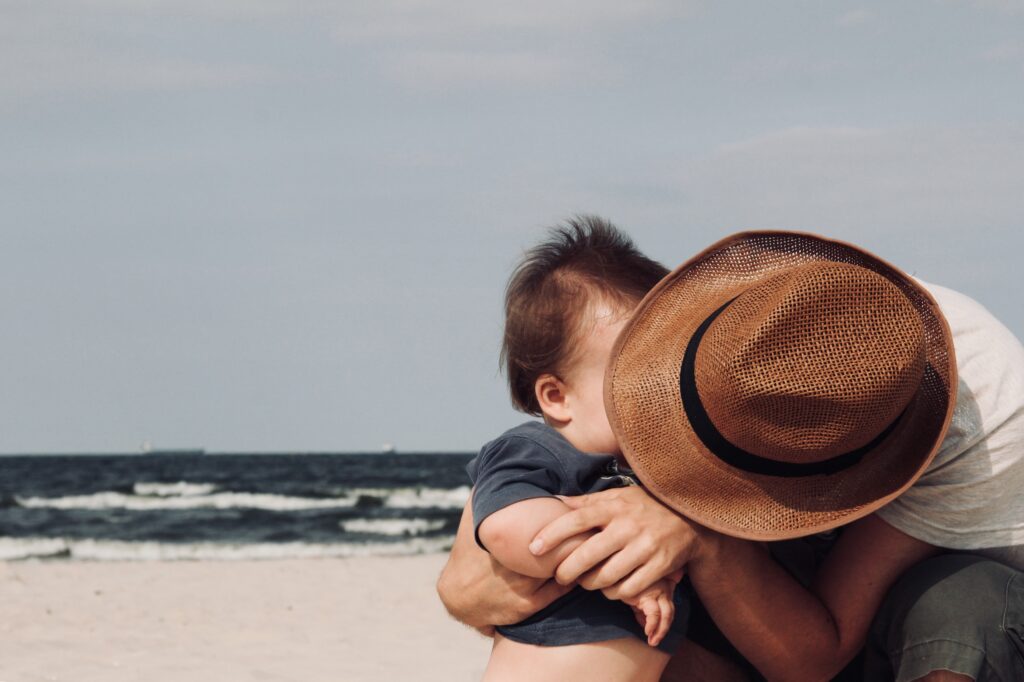 Parenting challenges - Father holding baby
